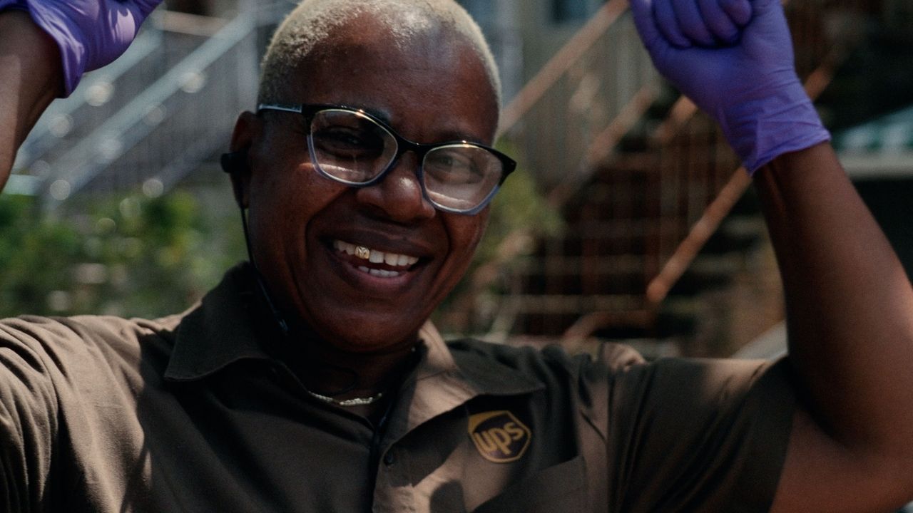 woman in a UPS uniform and gloves